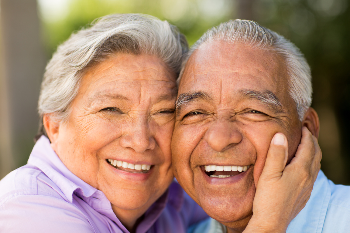 Hispanic senior couple laughing